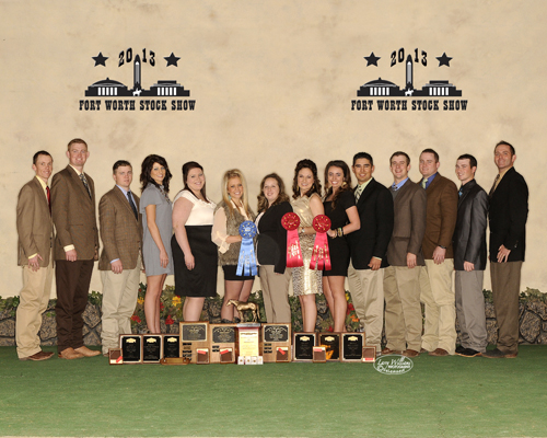 Students standing in front of the 2013 Fort Worth Stock Show banner backdrop with their awards.