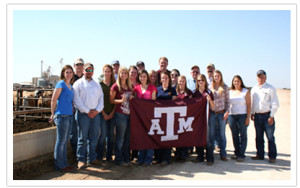 Group of students with the Texas A&M flag