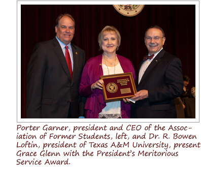 Porter Garner, president and CEO of the Association of Former Students with Grace Glenn. Standing to the right is Dr. R. Bowen Loftin, President of Texas A&M University.