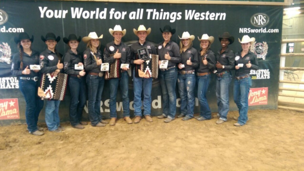 Group of people standing in front of a banner