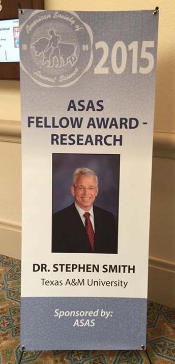 A banner announcing Dr. Stephen Smith's award at a conference.