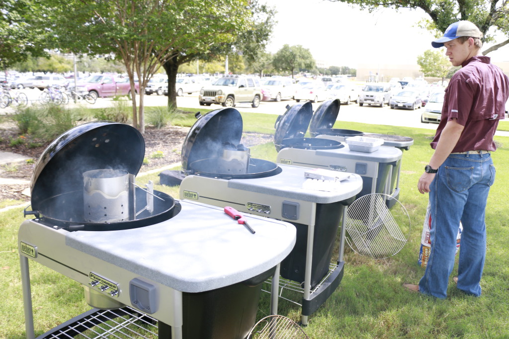 A student watches multiple smokers