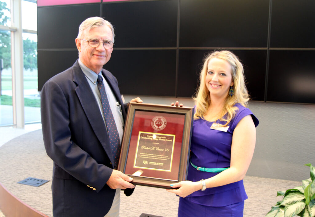 Jim Sanders, Ph.D. presents the Animal Science Outstanding Young Alumni Award to Rachel Cutrer ’01.