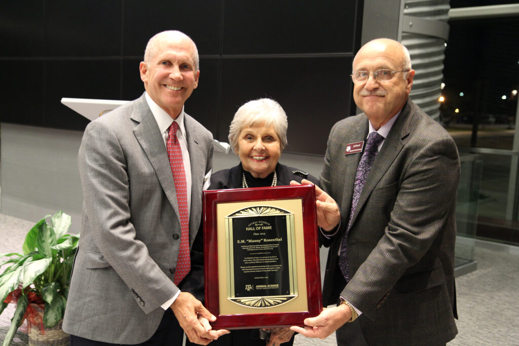 Jeff Savell, Ph.D., right, presents a plaque to Billy Rosenthal and Roz Rosenthal in recognition of E.M. “Manny” Rosenthal’s posthumous induction into the Animal Science Hall of Fame.