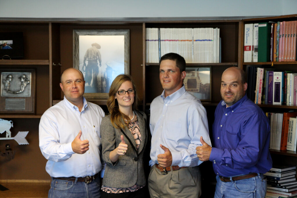Left, Justin Gleghorn, business analyst, Alyssa Word and Levi Trubenbach, graduate students, and Kevin Hazelwood, vice president and director of employee development.