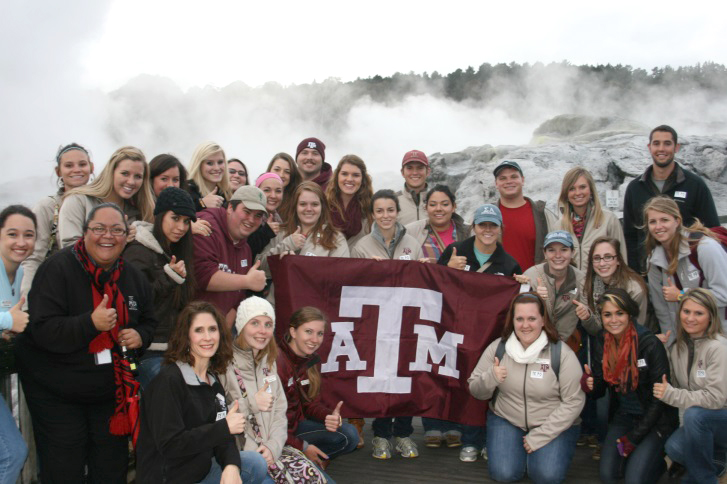 A group of students holding a flag