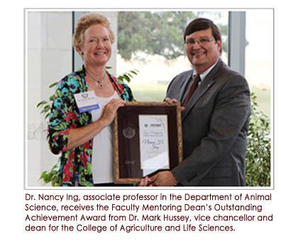 Dr. Nancy Ing, associate professor in the Department of Animal Science, receives the Faculty Mentoring Dean's Outstanding Achievement Award from Dr. Mark Hussey, vice chancellor and dean for the College of Agriculture and Life Sciences.