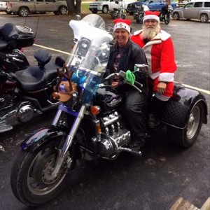 Becky with Santa Claus at the Toy Run in Dec. 2013.