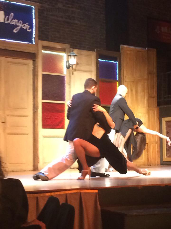 Students watching a Tango dance show.