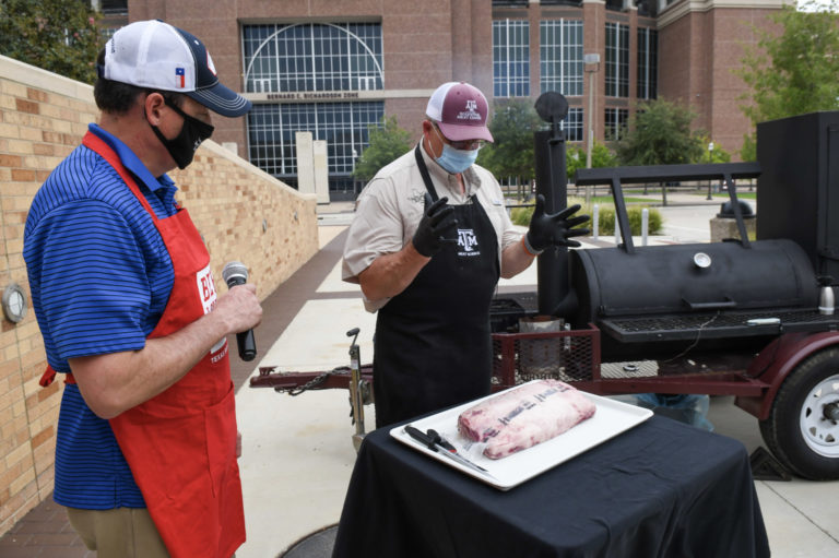 Davey Griffin, center, AgriLife Extension meat specialist, discusses cooking prime rib.