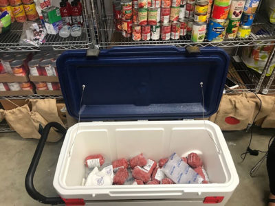 A cooler of meat at the 12th Can pantry