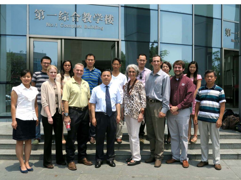 Dr. Chad Paulk standing with a group in China.