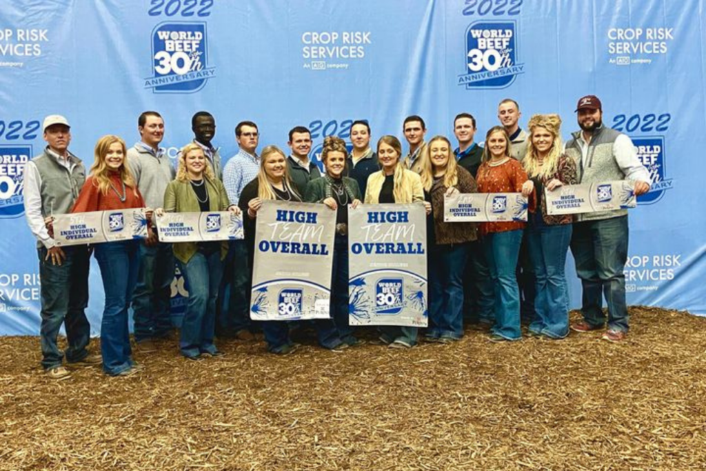The Livestock Judging Team standing with their awards and banners.