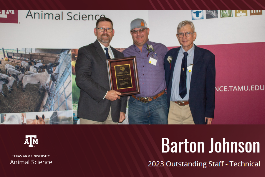 Barton Johnston, center, with his award.