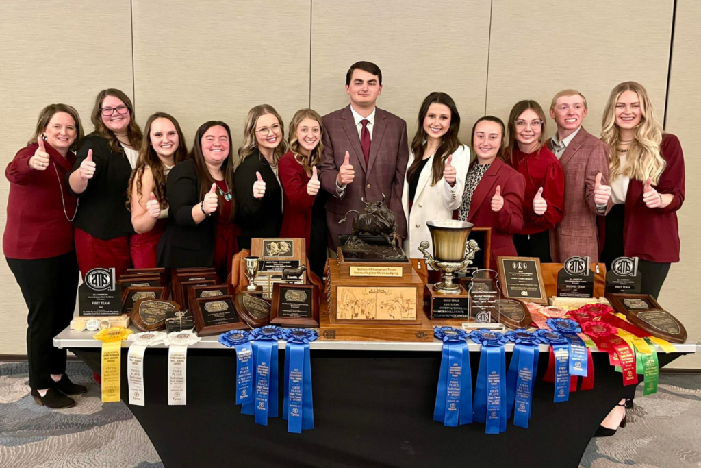 The Texas A&M Meat Judging Team standing with their awards.