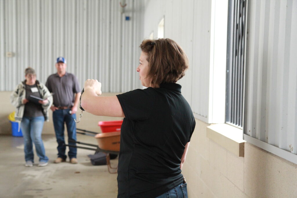 Woman speaking to people. 