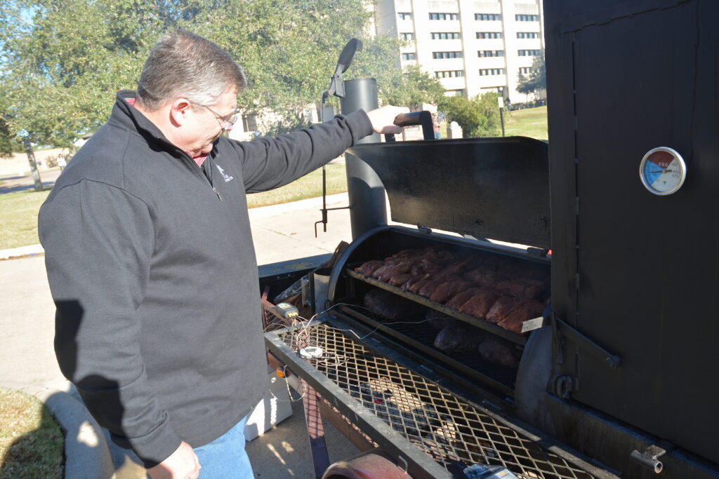 Dr. Davey Griffin, Texas A&M AgriLife Extension Service meat specialist, cooks beef sirloin, beef strip loin and pork loin.
