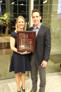 Erin & Josh Hawley standing with an award