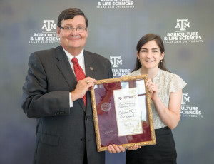 Dr. Mark Hussey standing with Tasha Womack.