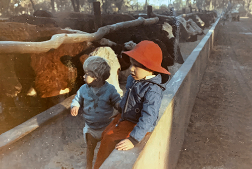 Dr. G. Cliff Lamb (right) on his father’s livestock and crop operation in Rhodesia as a young boy.