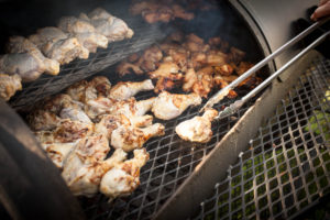 Chicken being grilled on a grill.