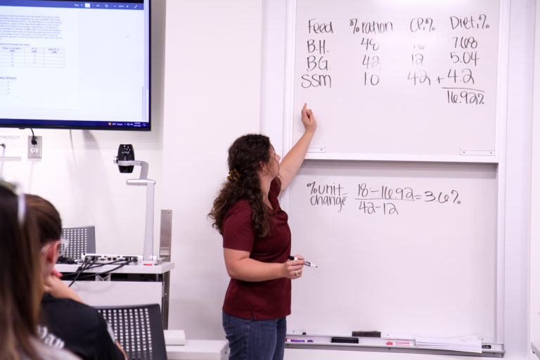 Alyson teaching students in the ANSC 318 lab.