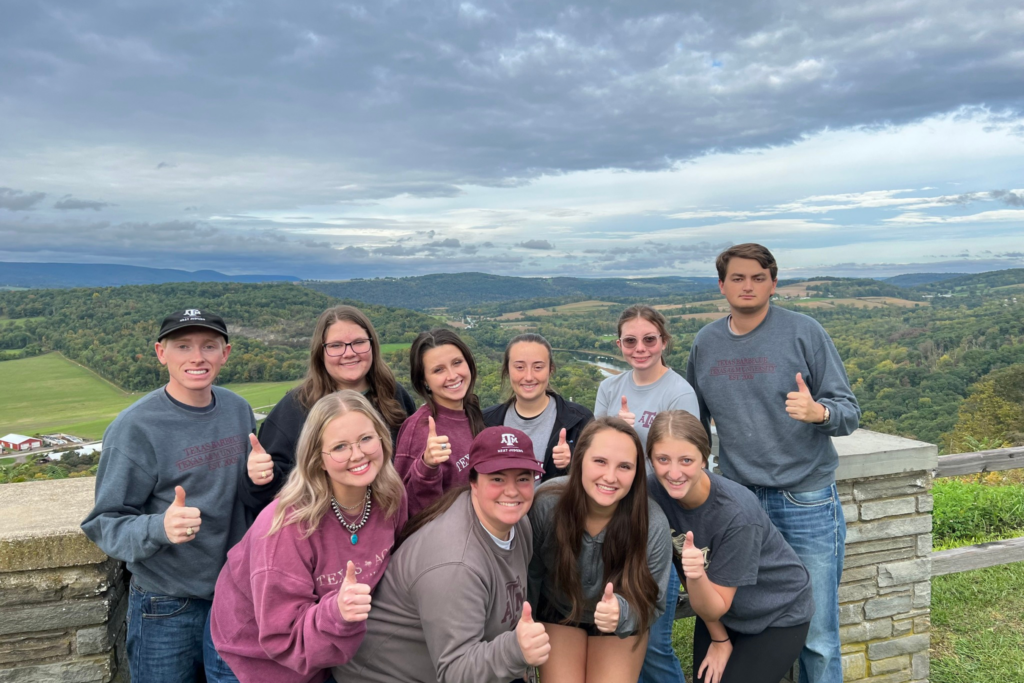 The Meat Judging Team outside with their thumbs up.