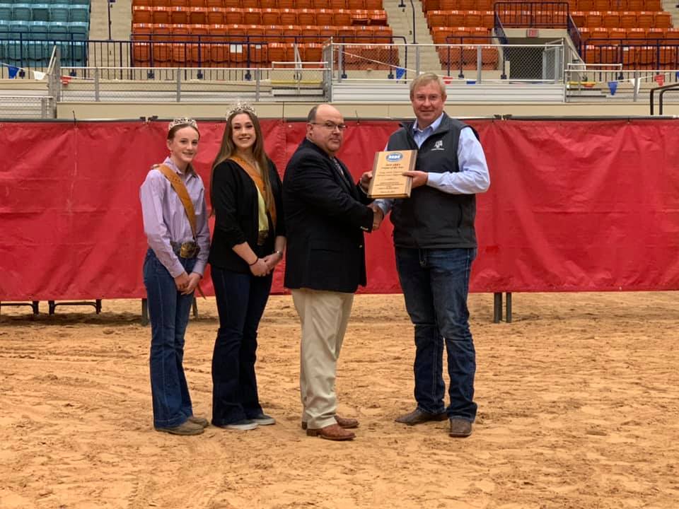 Dr. Cliff Lamb, right, accepting an award.