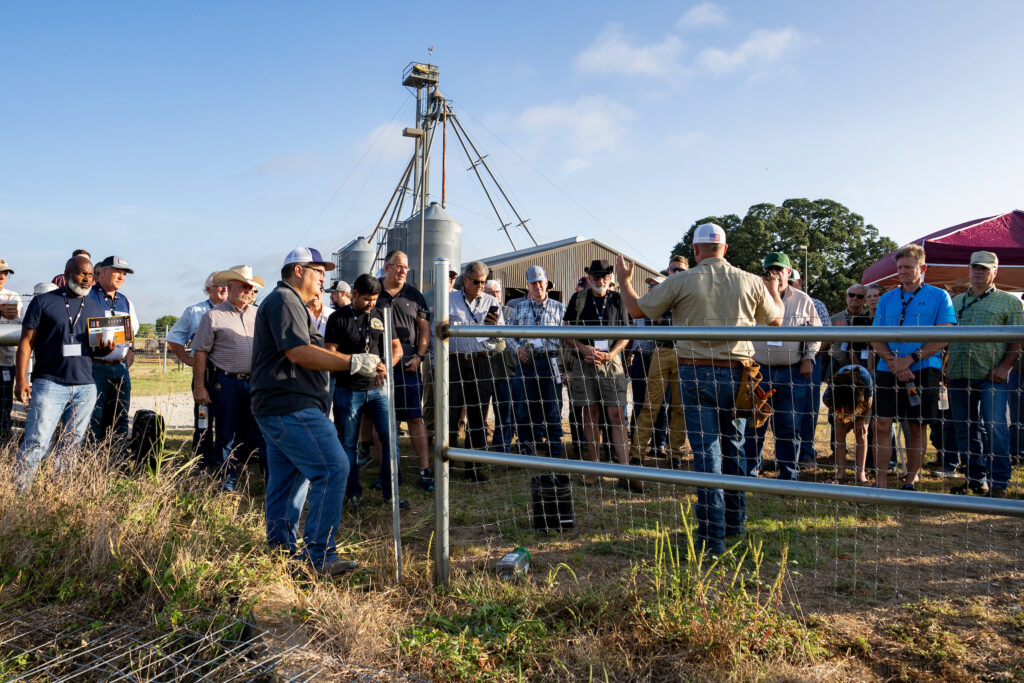 A big group of people standing together in and outdoor setting.