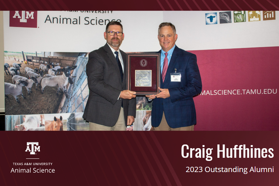 Craig Huffhines standing with his award