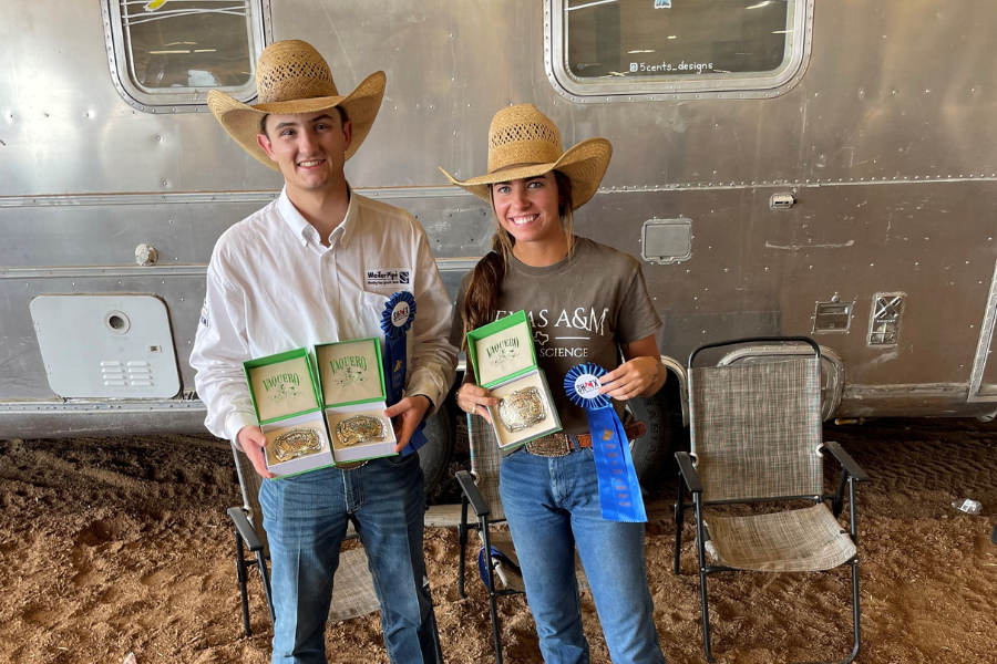 two people posing with awards