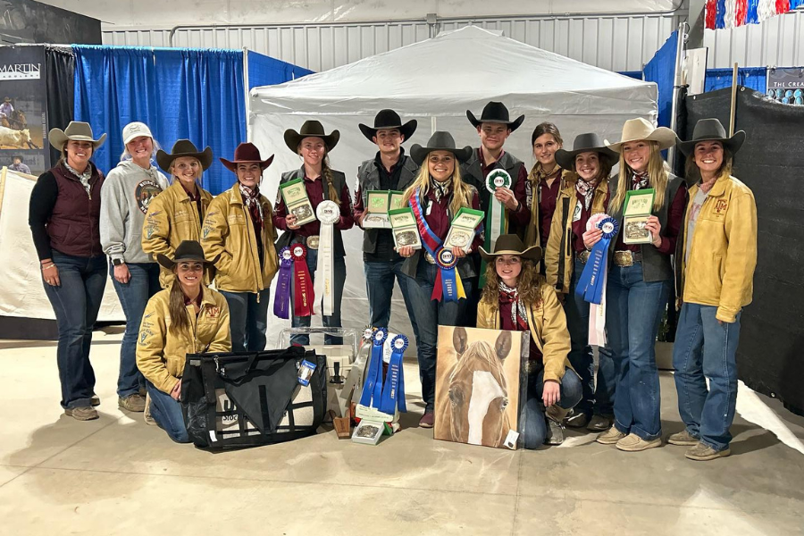 group of people posing with awards