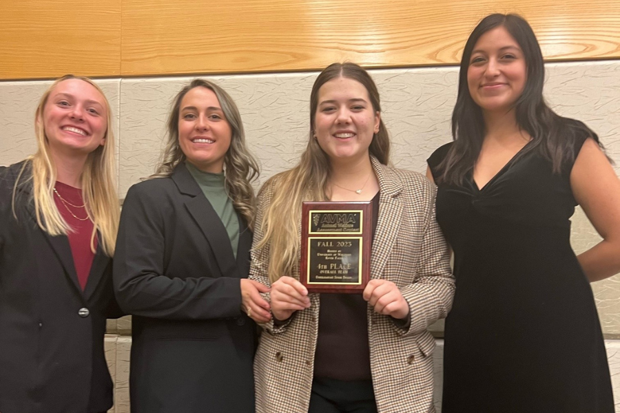 students posing with awards