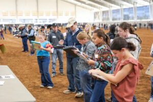 Students writing on clipboards